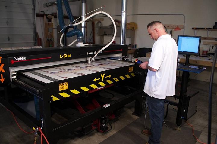 Man Operating an LST Kiss Cutting System